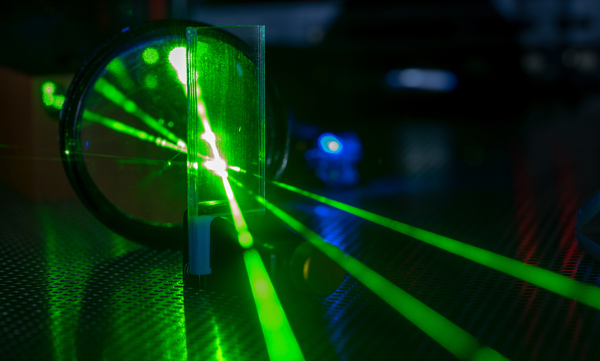 Green laser on optical table in a quantum optics laboratory